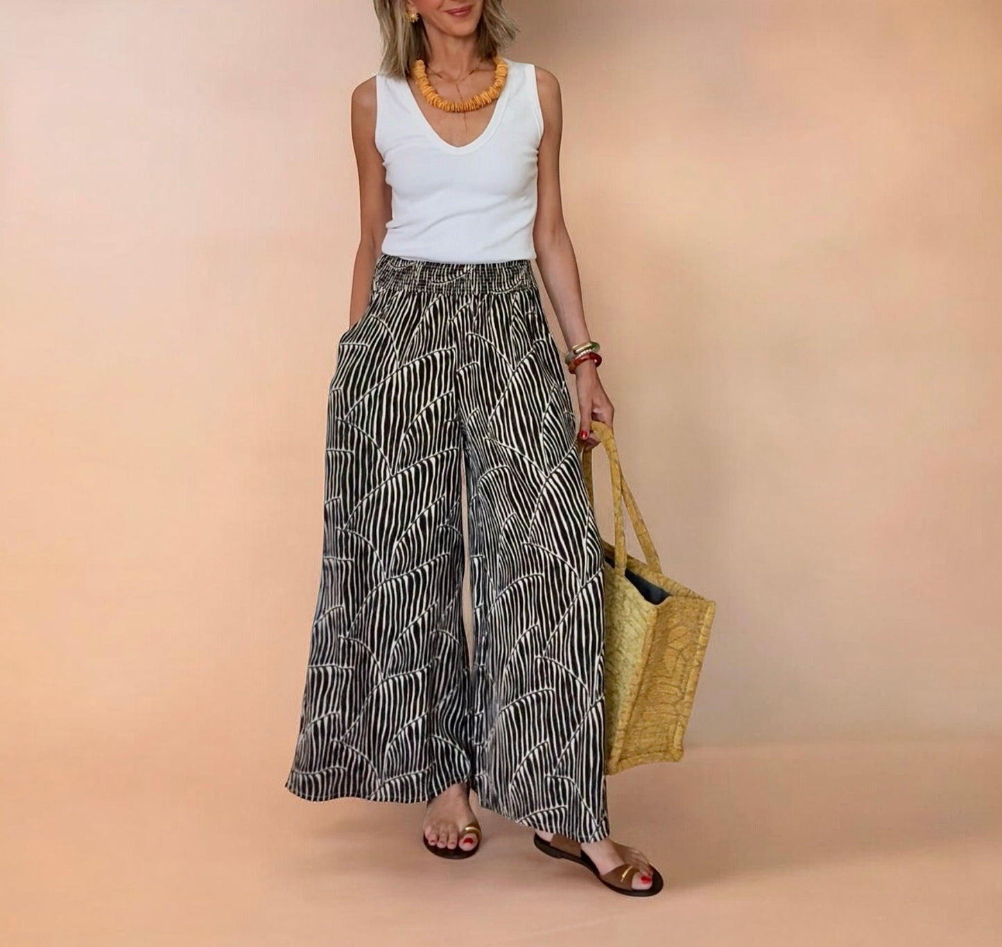 Pantalón estampado negro & beige